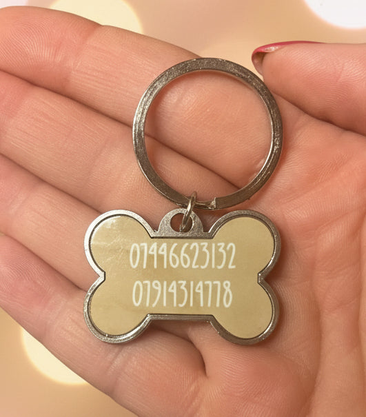 Silver dog bone shaped dog tags