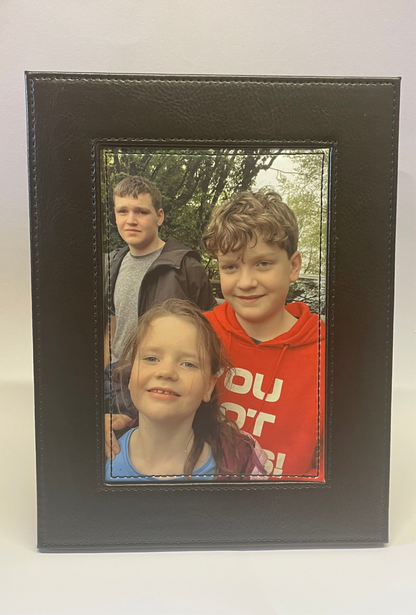 Brown faux leather photo in frame