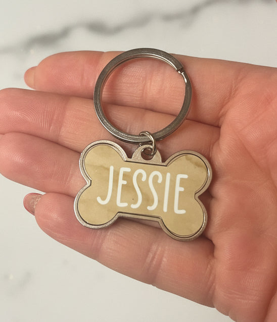 Silver dog bone shaped dog tags