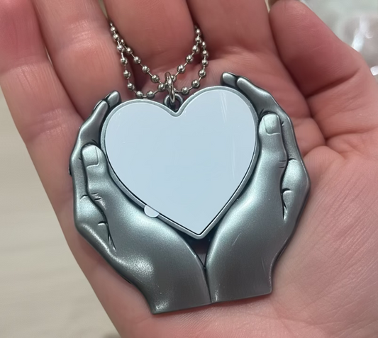 Hanging heart in hands decoration